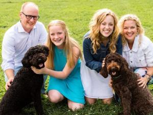 Steward family portrait with their dogs
