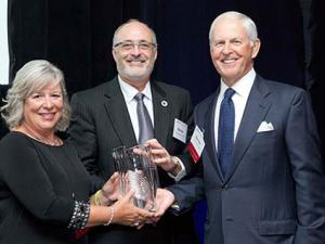 Nancy and Gordon Wright with DCI Executive Director Michael Kastan receiving the Shingleton Award
