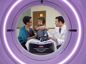Patient and physician framed by CT scanner
