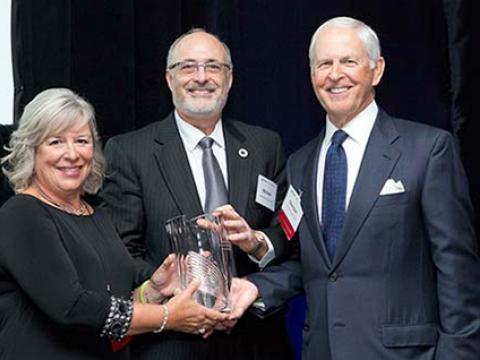 Nancy and Gordon Wright with DCI Executive Director Michael Kastan receiving the Shingleton Award