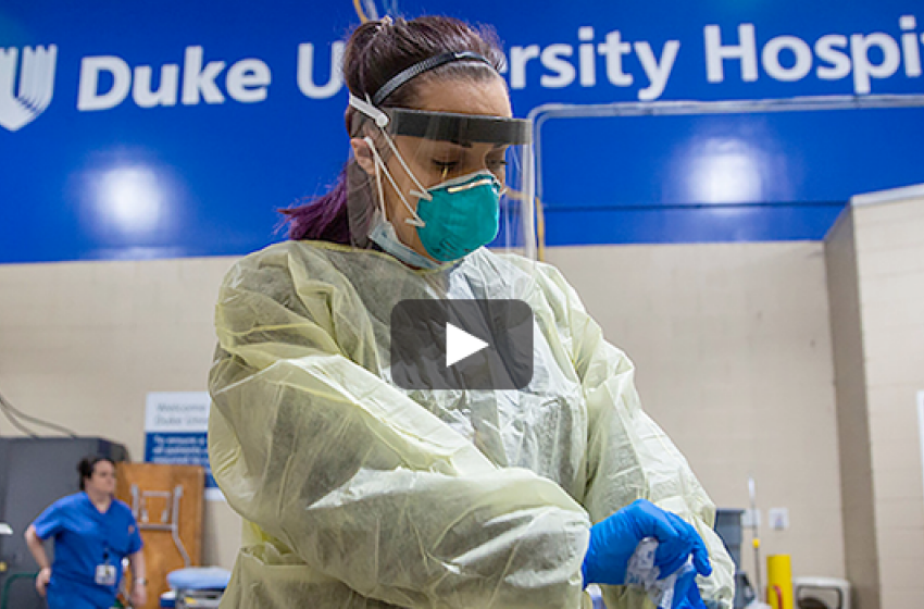 Video still of nurse at Duke Hospital wearing protective gear