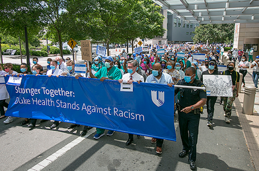 Hundreds of faculty and staff march in the Duke Health Walk for Solidarity, part of the national “White Coats for Black Lives” movement, on June 10, 2020.